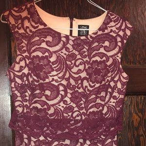 A long body-fitted burgundy dress